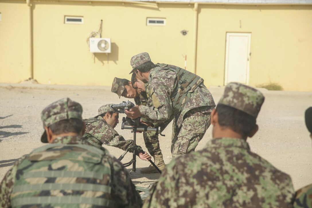 Afghan National Army soldiers with 6th Kandak, 1st Brigade, 215th Corps unload a simulated round from a 60mm mortar at the Helmand Regional Military Training Center aboard Camp Shorabak, Afghanistan, Oct. 7, 2017. Hundreds of soldiers with the unit began an operational readiness cycle Sept. 30, an eight-week training evolution led by ANA instructors designed to bolster the unit’s warfighting capabilities to help combat insurgency throughout the province. (U.S. Marine Corps photo by Sgt. Lucas Hopkins)
