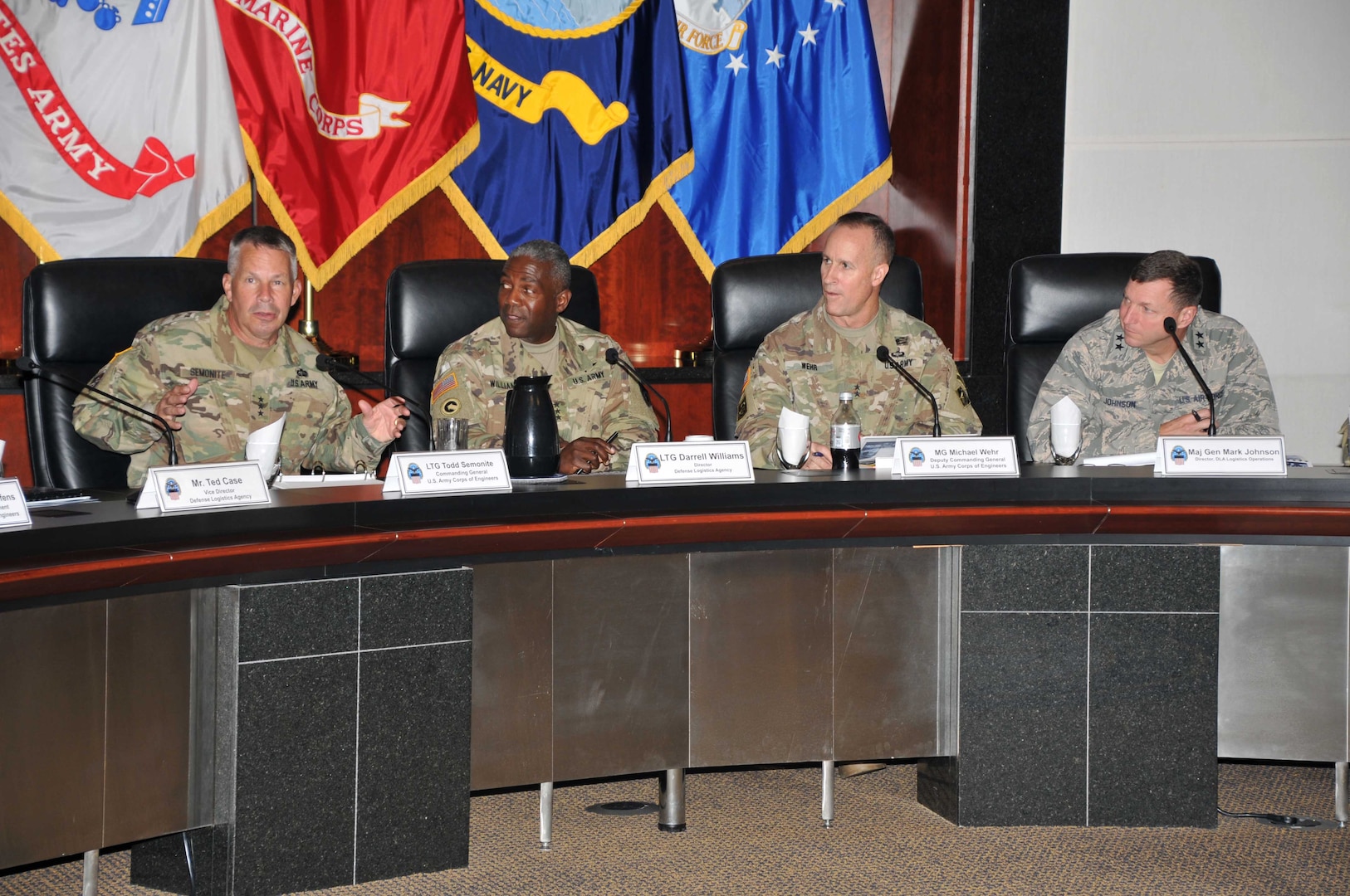 Generals at table facing viewer