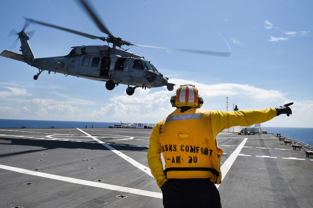 An MH-60S Sea Hawk helicopter takes off from the Military Sealift Command hospital ship USNS Comfort.