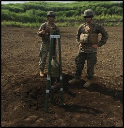 Combat Engineers pose with a shape charge aboard CATC-Fuji