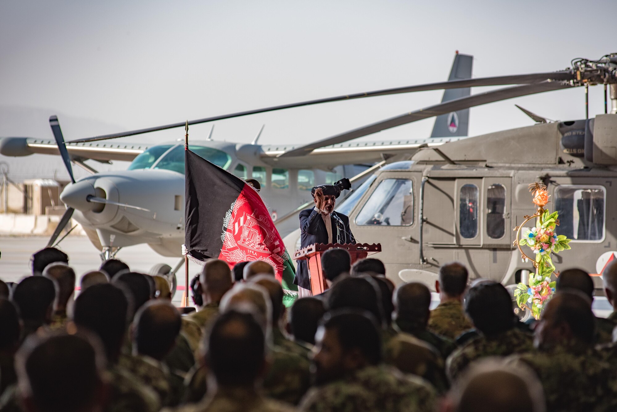 Afghanistan President Ashraf Ghani speaks during the official UH-60 Black Hawk arrival ceremony, Oct. 7, 2017, at Kandahar Airfield, Afghanistan. Ghani and U.S. Army Gen. John W. Nicholson, commander of the Resolute Support Mission and U.S. Forces − Afghanistan, performed a ceremonial ribbon cutting celebrating the newest addition to Afghanistan’s young air force fleet while vowing continued commitment to the fight against the anti-government insurgency in Afghanistan. (U.S. Air Force photo by Staff Sgt. Alexander W. Riedel)