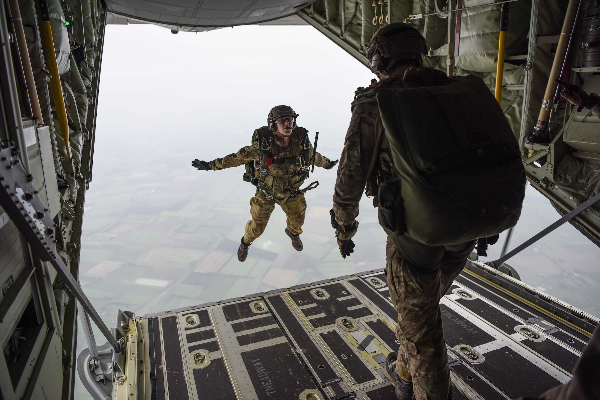 Airmen with the 321st Special Tactics Squadron, 352 Special Operations Wing execute a military free fall jump out of an MC-130J Commando II over southern England, 29 Sept. 2017. The air commandos performed this jump as maintain jump proficiency while ensuring readiness to execute global special operations at a moment's notice.