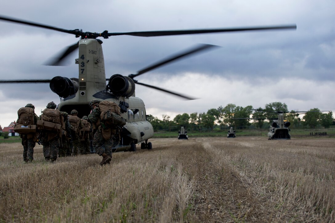 U.S. Marines with Marine Rotational Force-Europe board a U.S. Army CH-47 Chinook to transport them to their next training location during Exercise Aurora 17 in Lärbro, Sweden, Sept. 21, 2017. Aurora 17 is the largest Swedish national exercise in more than 20 years, and it includes supporting forces from the U.S. and other nations in order to exercise Sweden’s defense capability and promote common regional security. (U.S. Marine Corps photo by Cpl. Careaf Henson)