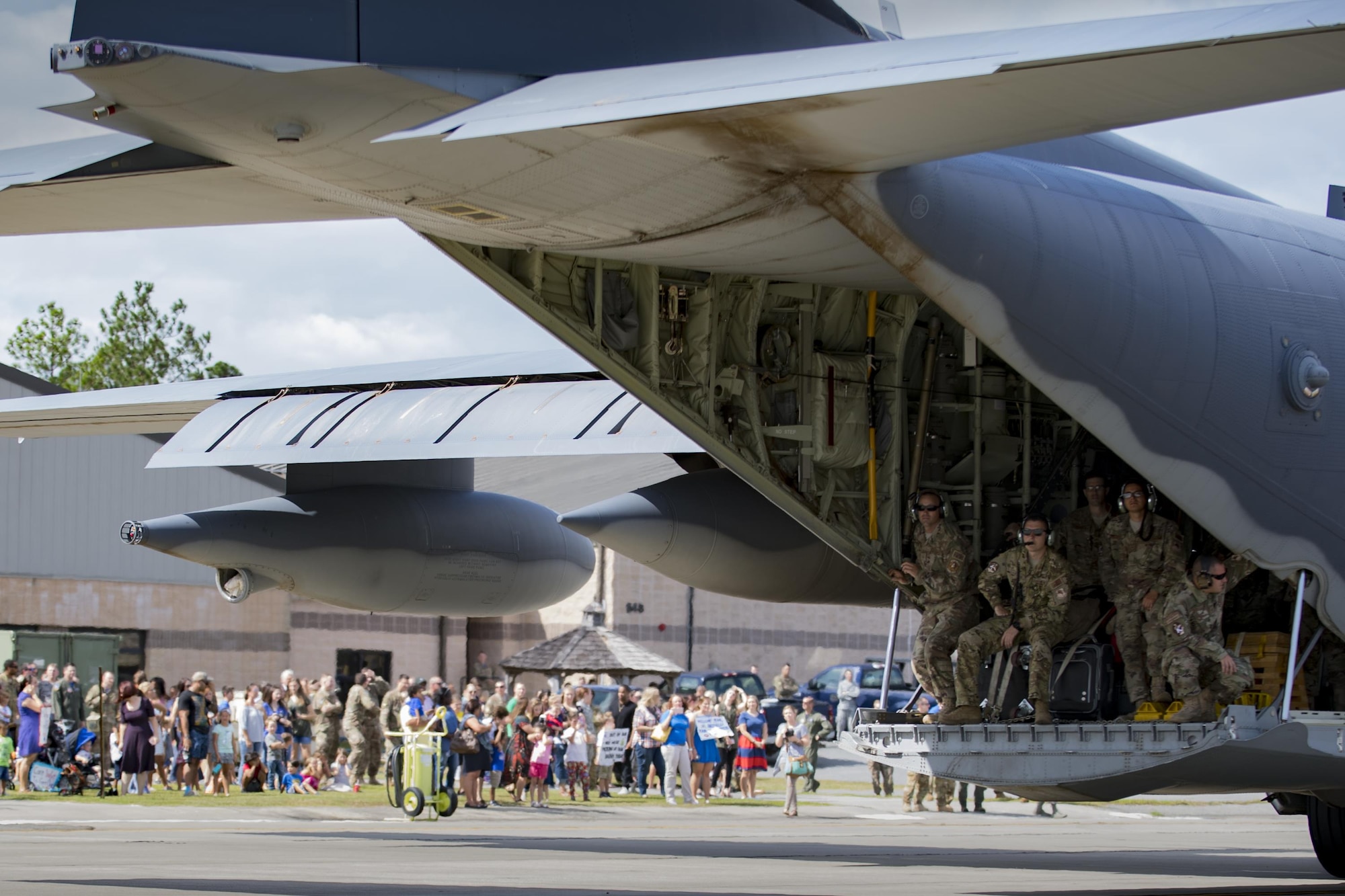 A 71st Squadron (RQS) HC-130J Combat King II taxis while Airmen and families wait to greet loved ones during a redeployment, Oct. 6, 2017, at Moody Air Force Base, Ga. Airmen from the 71st RQS supported deployed operations by providing expeditionary personnel with on-call recovery forces should they need rescued. (U.S. Air Force photo by Airman 1st Class Daniel Snider)