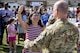 Claudia greets her husband, Lt. Col. Gary Symon, 71st Rescue Squadron (RQS) commander, during a redeployment, Oct. 6, 2017, at Moody Air Force Base, Ga. Airmen from the 71st RQS supported deployed operations by providing expeditionary personnel with on-call recovery forces should they need rescued. (U.S. Air Force photo by Airman 1st Class Daniel Snider)