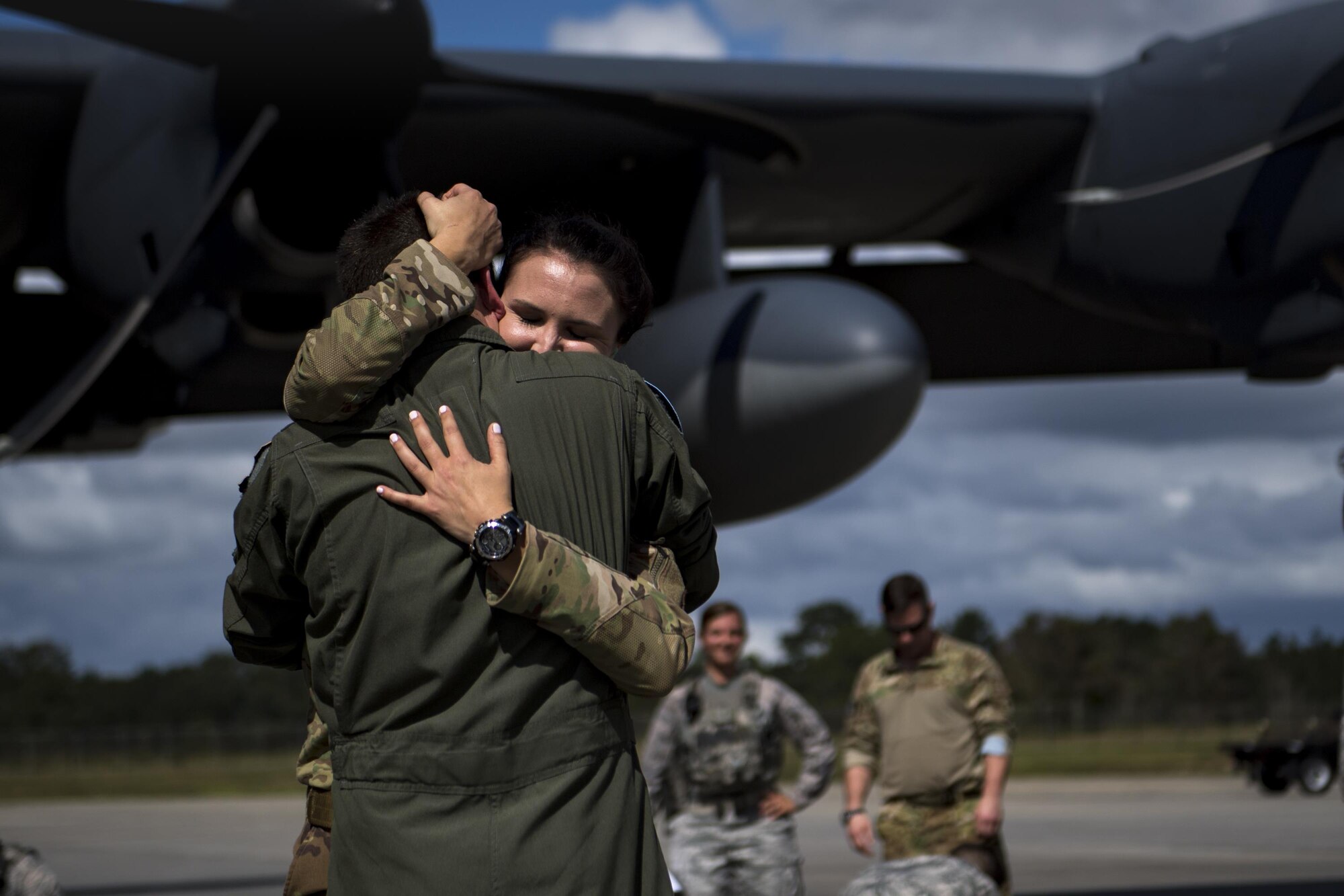 1st Lt. Ashton Thibodeau, 71st Rescue Squadron (RQS) combat systems officer, greets her loved one during a redeployment, Oct. 6, 2017, at Moody Air Force Base, Ga. Airmen from the 71st RQS supported deployed operations by providing expeditionary personnel with on-call recovery forces should they need rescued. (U.S. Air Force photo by Airman 1st Class Daniel Snider)