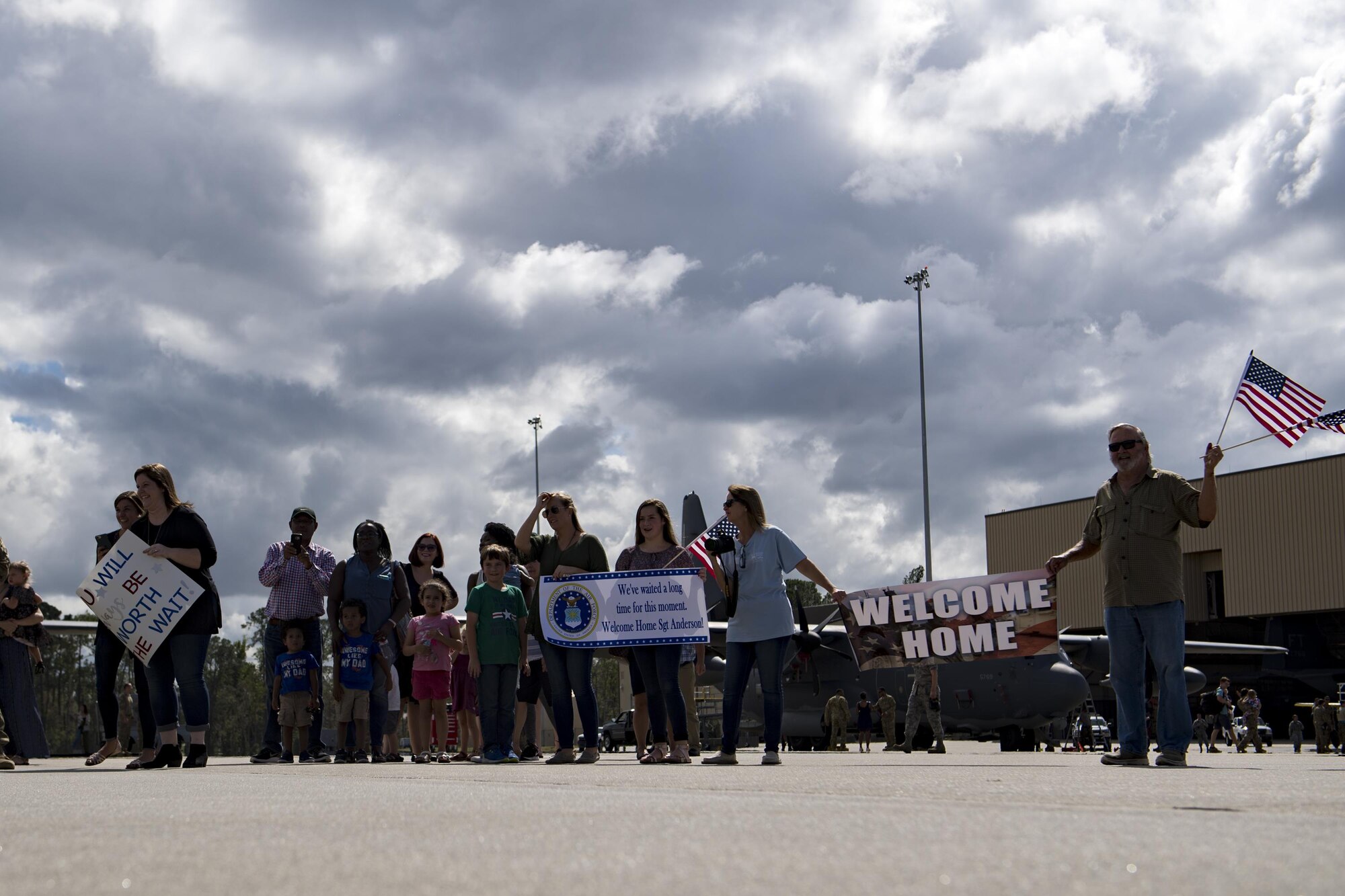Airmen and families await the return of the 71st Rescue Squadron during a redeployment, Oct. 6, 2017, at Moody Air Force Base, Ga. Airmen from the 71st RQS supported deployed operations by providing expeditionary personnel with on-call recovery forces should they need rescued. (U.S. Air Force photo by Airman 1st Class Daniel Snider)