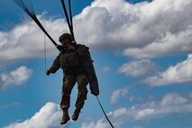 A member of the 820th Base Defense Group descends during a static-line jump, Oct. 3, 2017, at the Lee Fulp drop zone in Tifton, Ga. During a static-line jump, the jumper is attached to the aircraft via the ‘static-line’, which automatically deploys the jumpers’ parachute after they’ve exited the aircraft. (U.S. Air Force photo by Airman 1st Class Daniel Snider)