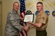 U.S. Air Force Lt. Col. Steven Watts, 17th Training Group deputy commander, 315th Training Squadron Student of the Month award for Sept. 2017 to U.S. Marine Corps Lance Cpl. Dylan Busby, 316th Training Squadron trainee, in the Brandenburg Hall on Goodfellow Air Force Base, Texas, Oct. 5, 2017. The 17th Training Wing's mission is to develop and inspire exceptional intelligence, surveillance and reconnaissance, and fire protection professionals for America and her allies. (U.S. Air Force photo by Airman 1st Class Randall Moose/released)