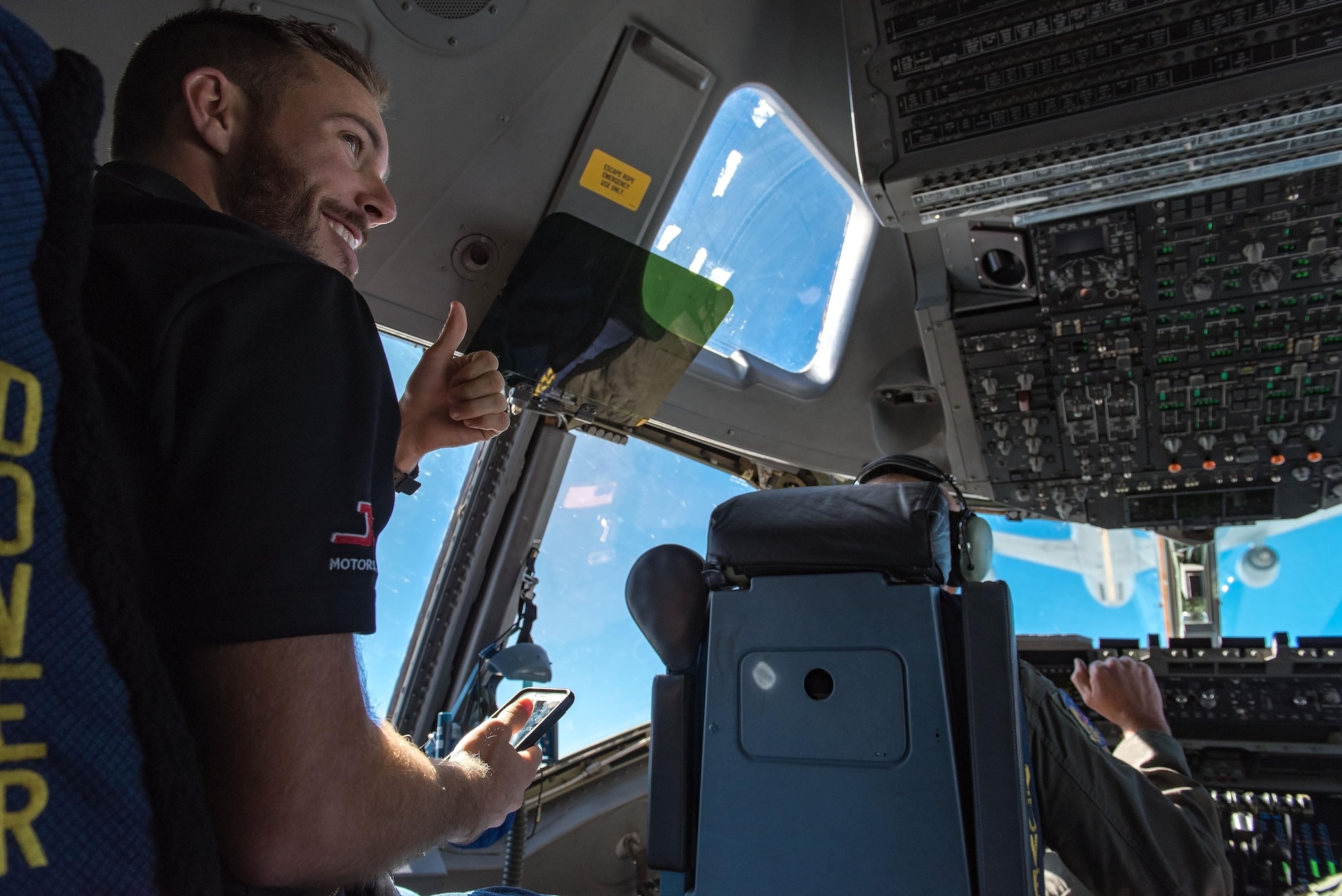 Ross Chastain, NASCAR Xfinity Series driver, observes and records 3d Airlift Squadron pilots flying a C-17 Globemaster III into position for air refueling Sept. 28, 2017, out of Dover Air Force Base, Del. Chastain observed the Globemaster III being refueled by KC-135T Stratotankers from the 127th Wing, Selfridge Air National Guard Base, Mich. (U.S. Air Force photo by Roland Balik)