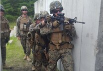Marines with 5th Platoon, Charlie Co. Fleet Anti-terrorism, Security Team, Marine Corps Security Forces Regiment practice at an indoor training facility during a training exercise at Marine Corps Base Quantico. Marines executed a military operations urban terrain and interior tactics field exercise at the Range Shoot House in order to enhance the platoon’s ability to fight in an urban environment. From August 8-17.