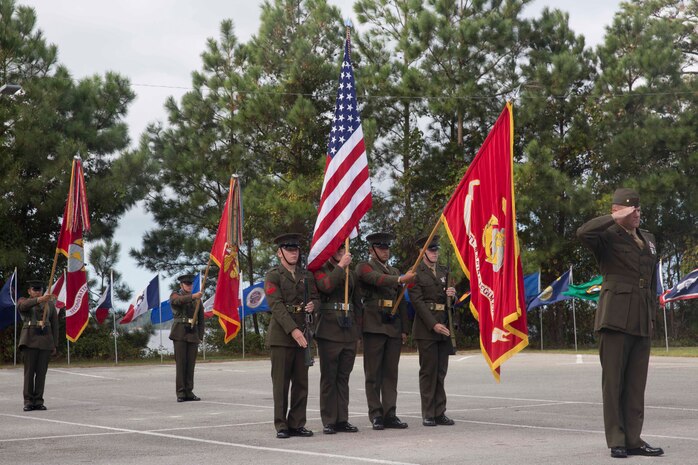 Marines salute the colors during an anniversary ceremony at Camp Lejeune, N.C., Oct. 6, 2017. Marines of past and present gathered to commemorate the 100th anniversary of the inception of 8th Marine Regiment. The unit was established Oct. 9, 1917. (U.S. Marine Corps photo by Pfc. Nicholas Guevara)