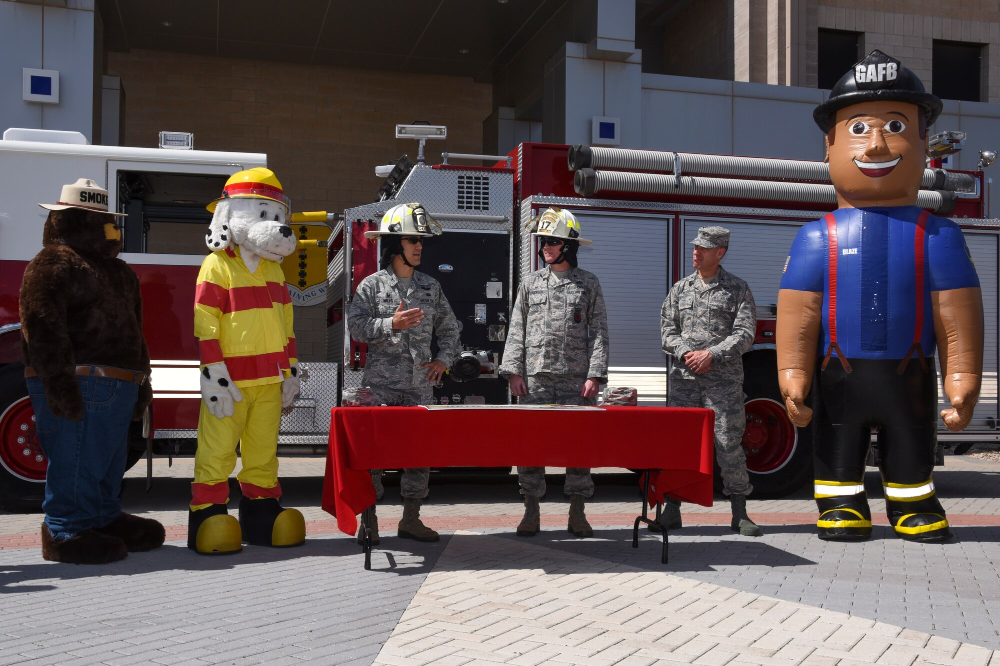 U.S. Air Force Col. Ricky Mills, 17th Training Wing commander, speaks to the crowd before signing the Fire Week Prevention proclamation at the Norma Brown Building on Goodfellow Air Force Base Oct. 5, 2017. With the help of Smokey, Spark and Blaze, the importance of knowing multiple ways out of each building and the importance of Fire Prevention Week was addressed by Mills. (U.S. Air Force photo by Airman Zachary Chapman/Released)