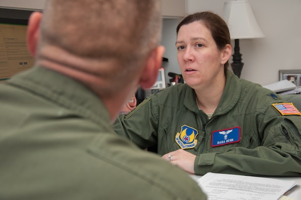 Lt. Col. Dara D. Regn, Aeromedical Consultation Service Internal Medicine branch chief, discusses a waiver recommendation case with a flight surgeon in the Residency in Aerospace Medicine program at Wright-Patterson October 5. Regn’s branch is currently reformatting their database of more than 1.2 million cardiology studies in order to enable more efficient data mining in what is believed to be the world’s largest database of its kind. (U.S. Air Force photo/John Harrington)