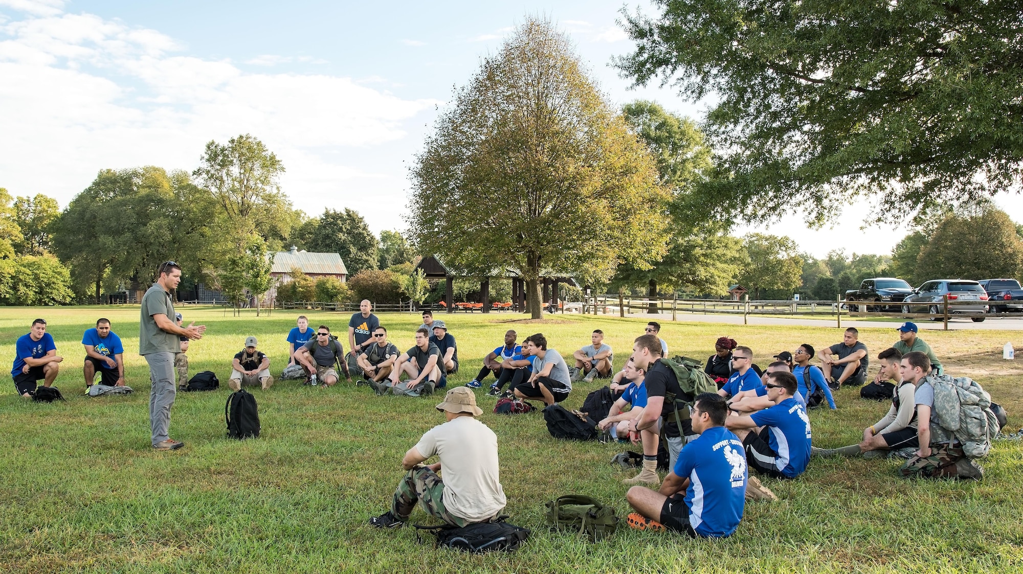 U.S. Army Master Sgt. Todd Fetzer, 1st Special Forces Command (Airborne), Ft. Bragg, N.C., tells the history of GORUCK to event participants Oct. 6, 2017, at Brecknock Park in Camden, Del. Fetzer, also known by his GORUCK nickname “Fury,” was the cadre for the 2017 GORUCK Light Challenge. (U.S. Air Force photo by Roland Balik)