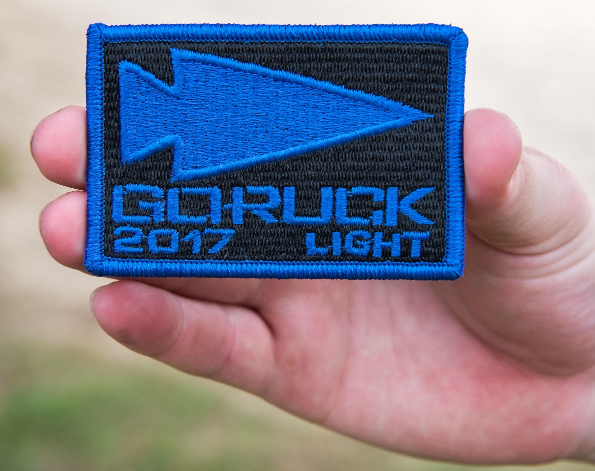 Autumn Anderson, 436th Maintenance Squadron aerospace maintenance apprentice, holds her 2017 GORUCK Light Challenge patch, Oct. 6, 2017, at Brecknock Park in Camden, Del. Anderson was one of 29 individuals who completed the five-hour GORUCK Challenge. (U.S. Air Force photo by Roland Balik)