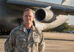 Master Sgt. D.J. Little, a 94th Maintenance Squadron hydraulic technician, poses for a photo in front of a C-5M Super Galaxy at Dobbins Air Reserve Base, Ga. Oct. 6, 2017. Little worked alongside technicians from Dover Air Force Base, Dela. to create custom hydraulic hoses to bypass a faulty actuator to make the necessary repairs so the plane could take communication equipment to Puerto Rico. (U.S. Air Force photo/Staff Sgt. Andrew Park)