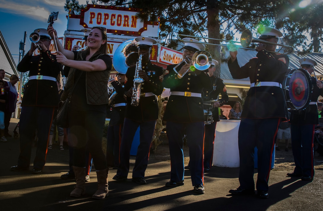 A Maine native takes a selfie with the brass ensemble of the Marine Corps Recruit Depot Parris Island during their performance at the Fryeburg Fair in Fryeburg, Maine, Oct. 2, 2017. The band's ensemble was in the Recruiting Station Portsmouth's area of operation for a tour of select high schools and events to highlight the Musician Enlistment Option Program and aid in recruiting activities.