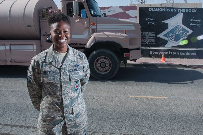 Master Sgt. Mendy Dillard poses for a portrait in front of a fire truck at an undisclosed location in Southwest Asia Wednesday, 11 October 2017. Dillard is celebrating her 11th year serving the Air Force as a firefighter. (U.S. Air Force photo by Master Sgt. Eric M. Sharman)