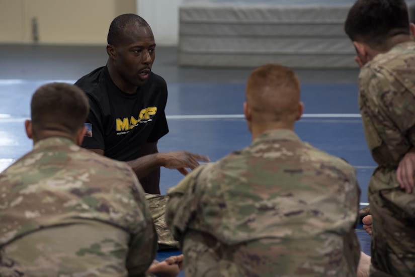 Instructor provides guidance to a group of Soldiers.
