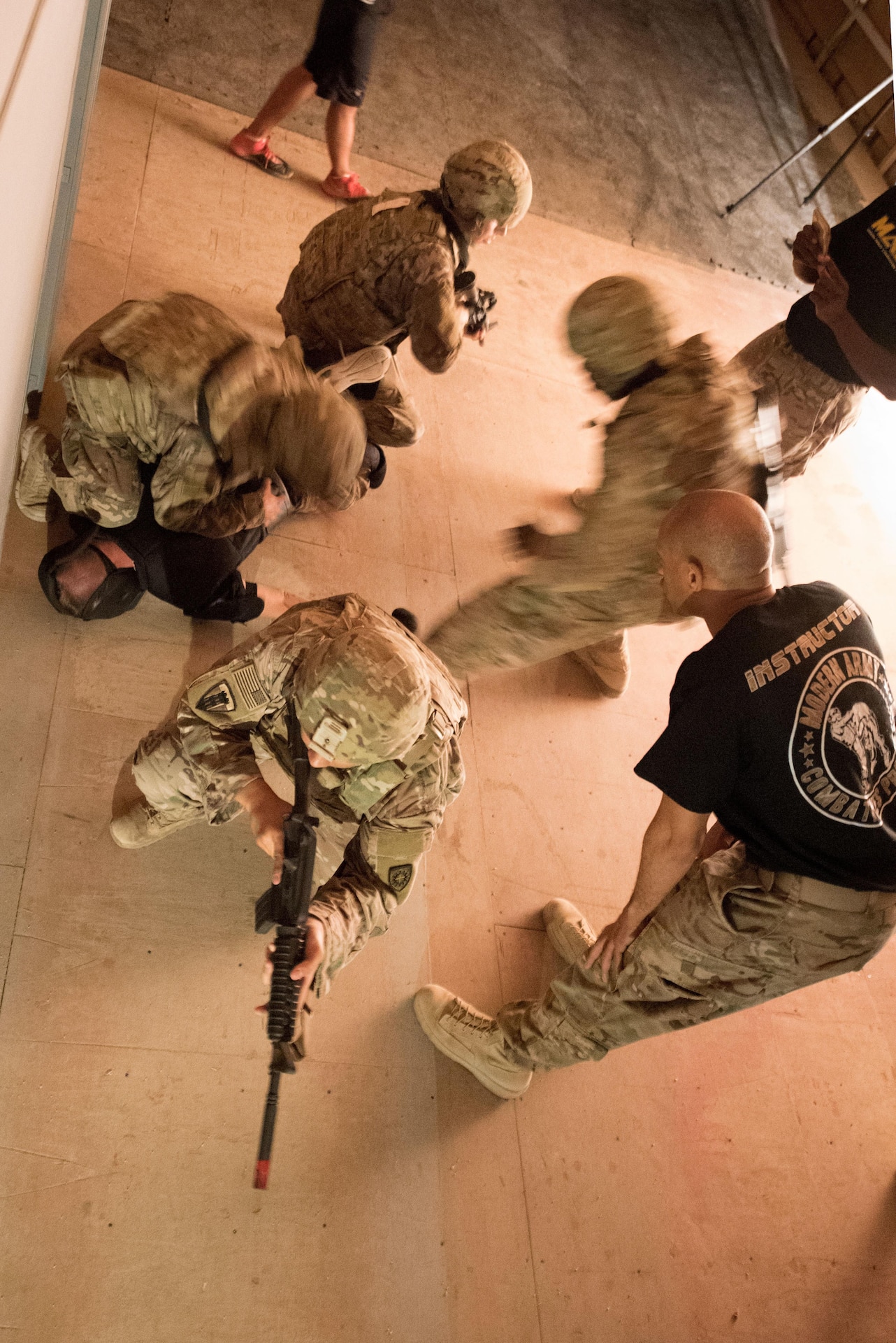 A group of Soldiers subdue a roleplayer