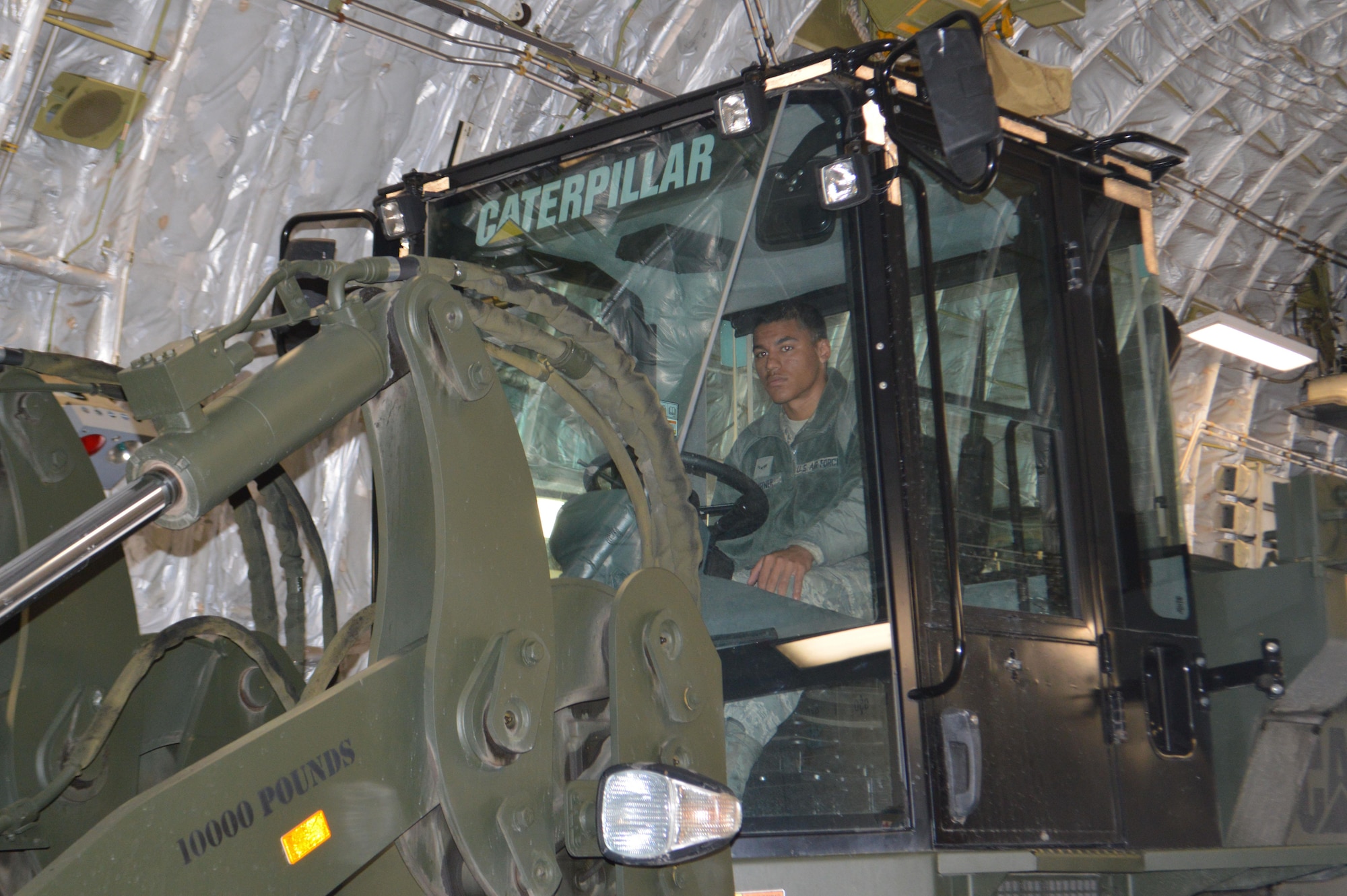 Airman 1st Class Curtis Taylor, aerial port airman, 21st Logistics Readiness Squadron, drives a 10K forklift while loading equipment onto a C-17 Globemaster III aircraft Sept. 29 at the Fort Carson Arrival/Departure Air Control Group. Approximately 150 Fort Carson 4th Sustainment Brigade, 4th Infantry Division Soldiers deployed to Puerto Rico and the Virgin Islands to support Federal Emergency Management Agency and relief operations on the island after it was devastated by Hurricane Maria. (U.S. Army photo by Dani Johnson)
