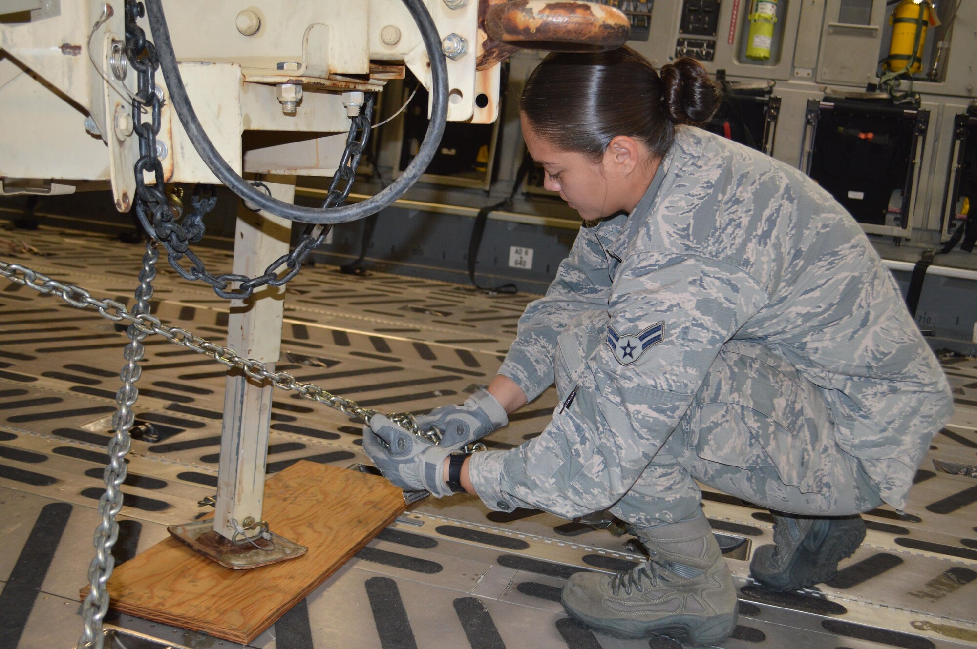 Airman 1st Class Erica Barnes, aerial port airman, 21st Logistics Readiness Squadron, ties down a general-purpose trailer in a C-17 Globemaster III aircraft Sept. 29 at the Fort Carson Arrival/Departure Air Control Group. Approximately 150 Fort Carson 4th Sustainment Brigade, 4th Infantry Division Soldiers deployed to Puerto Rico and the Virgin Islands to support Federal Emergency Management Agency and relief operations on the island after it was devastated by Hurricane Maria. (U.S. Army photo by Dani Johnson)