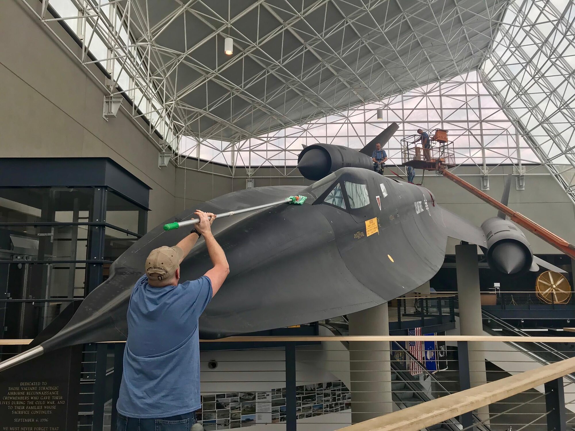 Airmen from the 820th Intelligence Squadron, Offutt Air Force Base, Nebraska, clean an SR-71 Blackbird Oct. 3, 2017 on display at the Strategic Air Command Aerospace Museum, Ashland, Nebraska.