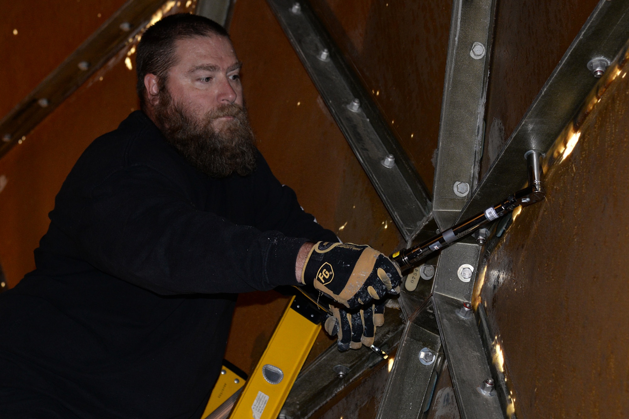 Wayne Howard, 526th Electronics Maintenance Squadron plastic fabricator inspector and team lead, uses a torque wrench to tighten bolts that hold the radomes fiberglass panels together at Cape Romanzof, Alaska on Sep. 26, 2017. (U.S. Air Force photo by Alex R. Lloyd)