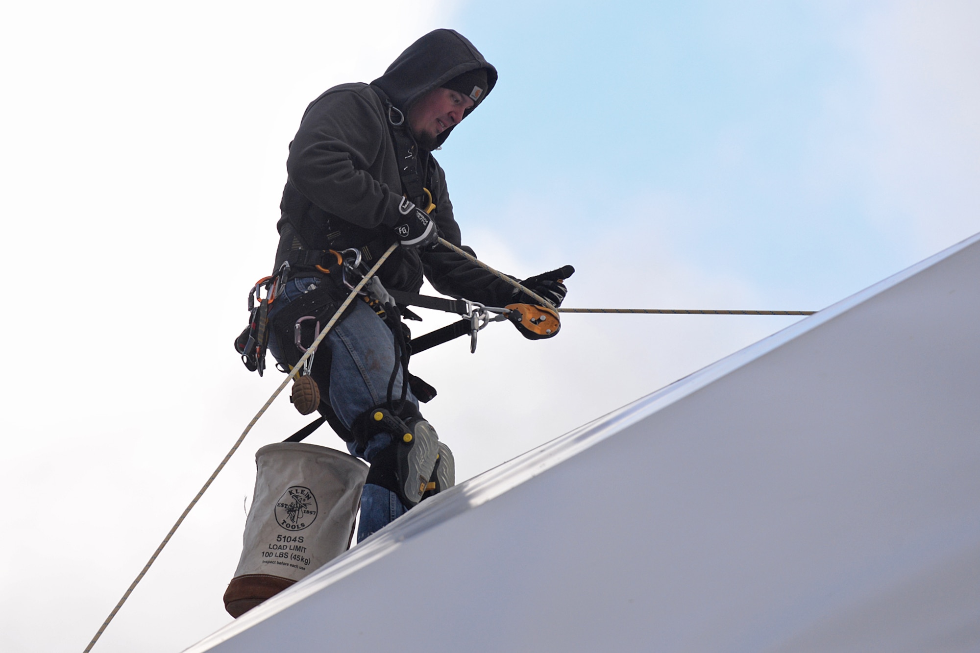 Justin Cevering, 526th Electronics Maintenance Squadron plastic fabricator inspector, uses a newly installed rope to repel down the side of a satellite communications radome at Cape Romanzof, Alaska, on Sep. 27, 2017. Ropes are secured to the tops of the radomes and allow inspectors to climb onto radome exteriors to perform maintenance. 
(U.S. Air Force photo by Alex R. Lloyd)