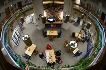 Depot field team members hold a production strategy meeting with Hal Olmstead and Bobby Gamsby in the residential dome common area at Cape Romanzof, Alaska, on Sep. 28, 2017. Inclement weather conditions during the day prevented the team from reaching the radome. (U.S. Air Force photo by Alex R. Lloyd)