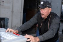 Jim Egbert, 526th Electronics Maintenance Squadron plastic fabricator inspector, loads a large container of supplies on Sep. 25, 2017 in Anchorage, Alaska, into the bed of a pickup truck. This container and other equipment, are prepositioned in a local storage unit to ensure they are available when needed and can be transported to any site in Alaska. . (U.S. Air Force photo by Alex R. Lloyd)
