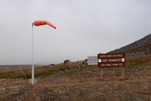 Upon landing and roll out, the chartered aircraft arrives at the northeast end of Cape Romanzof’s runway on Sep. 25, 2017, where everyone is greeted by the long range radar sites cold, windy and overcast conditions. (U.S. Air Force photo by Alex R. Lloyd)