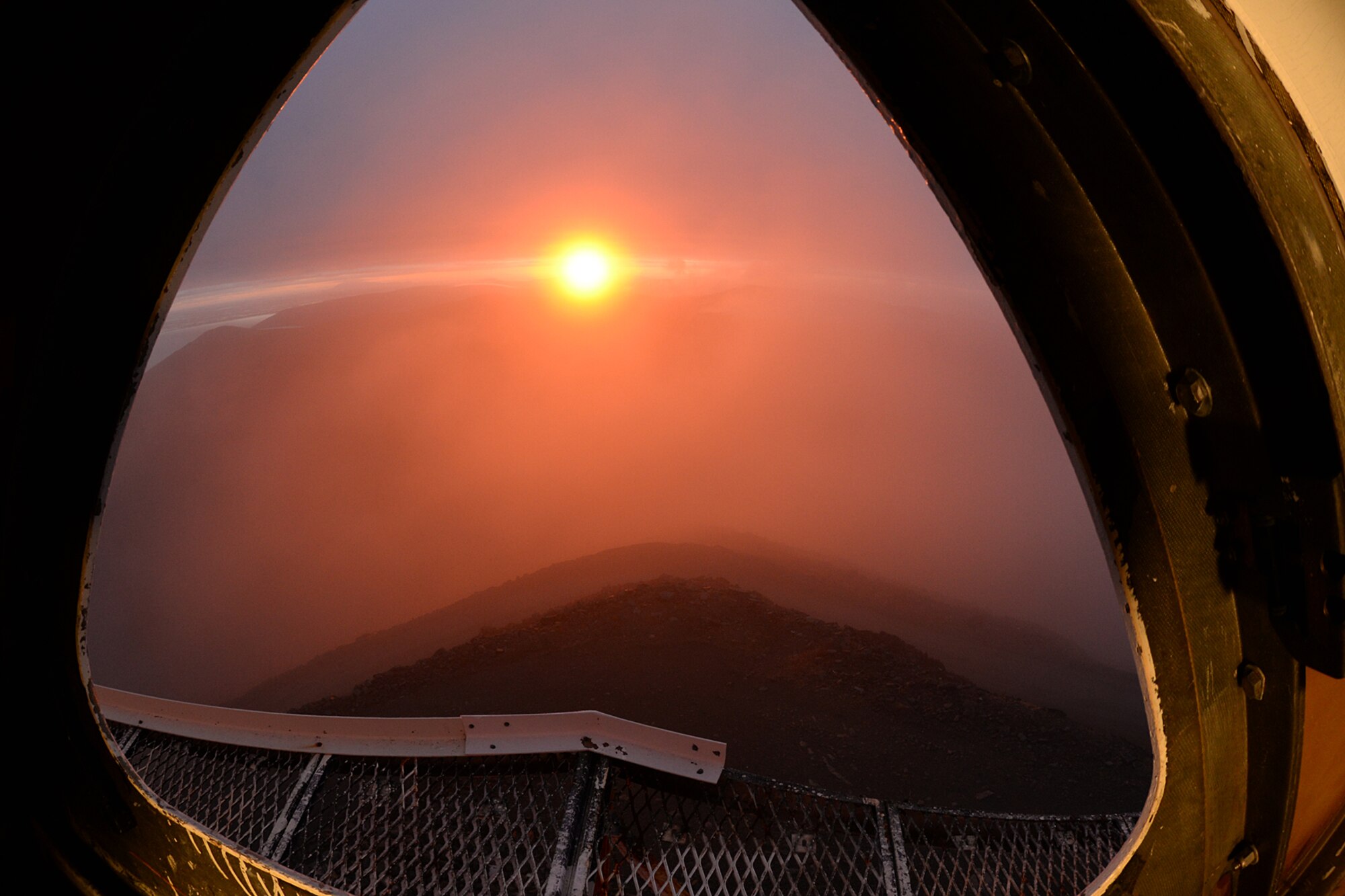 At Cape Romanzof, Alaska, depot field tream members start their day early inside the LRRS radome, on Sep. 26, 2017. The weather breaks long enough to view a beautiful sunrise over the Alaska interior. (U.S. Air Force photo by Alex R. Lloyd)