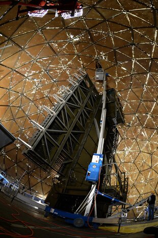 Justin Cevering, 526th Electronics Maintenance Squadron plastic fabricator inspector, uses a "man lift" to reach the top of the 50-foot-high radome structure on Sep. 26, 2017, at Cape Romanzof, Alaska. Bolts holding the structure together have to be checkedand often requires the use of ladders and lifts to reach them. (U.S. Air Force photo by Alex R. Lloyd)