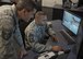 U.S. Air Force Tech. Sgt. Derek Mantzke, F-35 Academic Training Center avionics instructor, explains how to operate an Aircraft Systems Maintenance Trainer to Chief Master Sgt. David Brown, 19th AF command chief, Oct. 3, 2017, at Eglin Air Force Base, Fla. During Brown's visit at the 33rd Fighter Wing, Brown met with many of the instructors who mold future and current F-35 mechanics and pilots. (U.S. Air Force photo by Staff Sgt. Peter Thompson)