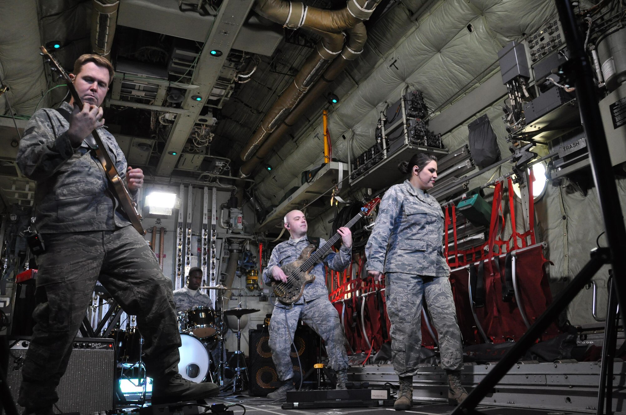 Members of the United States Air Force Academy Band’s, “Blue Steel,” perform inside an Air Force Reserve Command C-130 Hercules aircraft assigned to the 302nd Airlift Wing while recording scenes for their newest music video featuring the song “Fly Higher,” May 1, at Peterson Air Force Base, Colo.
