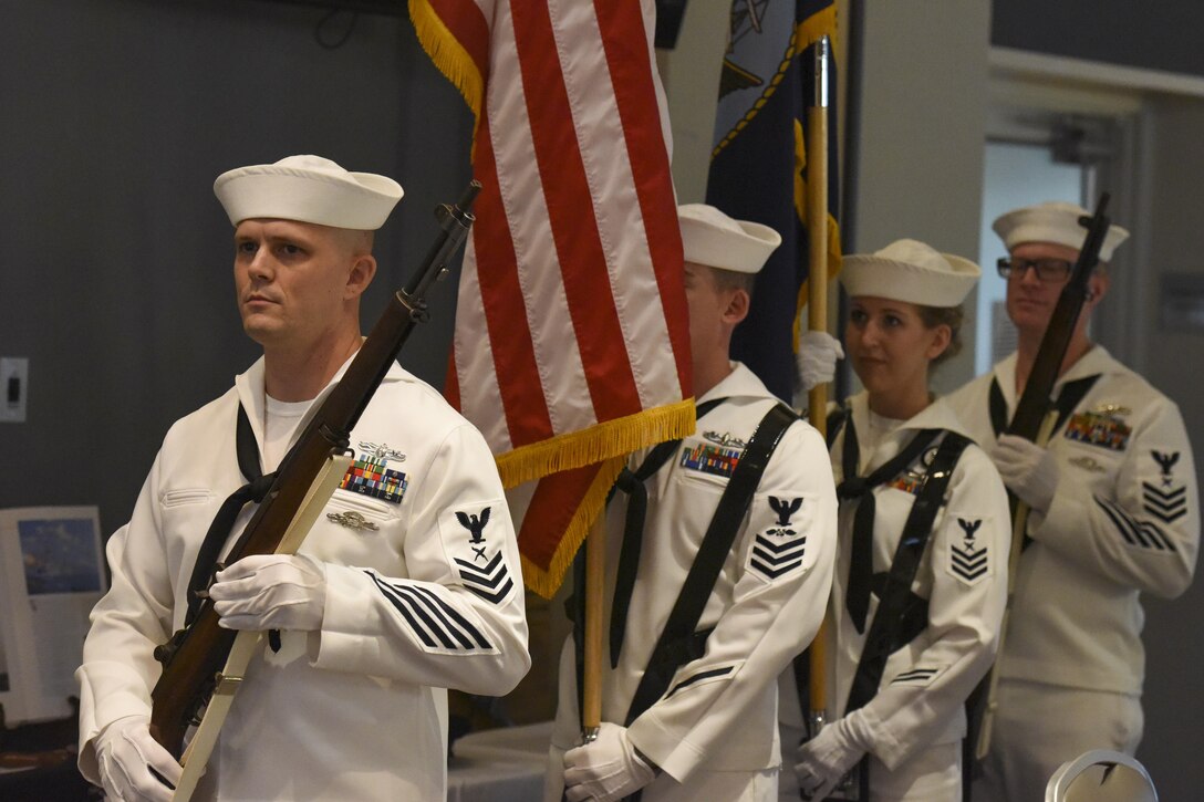 U.S. Navy color guard stand by for the start of the Navy Ball at the Event Center on Goodfellow Air Force Base, Texas Oct. 6, 2017. The evening ceremonies began with the posting of colors by the color guard and the setting of the POW/MIA table. (U.S. Air Force photo by Airman Zachary Chapman/Released)