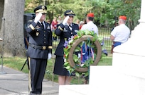 Brigadier Gen. Stephen E. Strand, left, deputy chief of engineers (Reserve affairs), and Chap. (Maj.) Dawn Siebold, 88th Regional Support Command chaplain, salute the wreath they placed at the tomb of former President Rutherford B. Hayes during a ceremony honoring the 19th president of the United States in Fremont, Ohio, October 8, 2017.