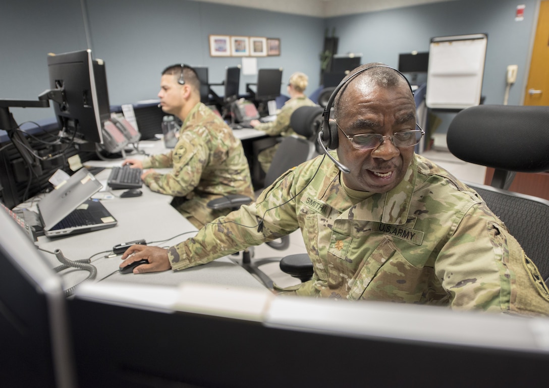 Soldiers at consoles conduct a missile defense exercise.