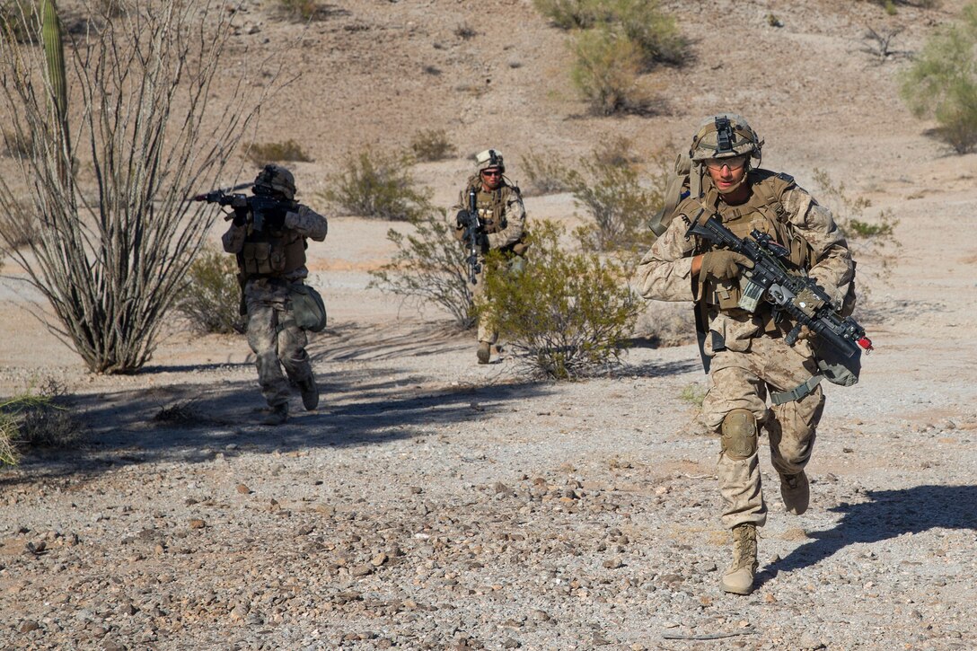 Marines advance toward their follow on objective during a weapons and tactics instructor course.