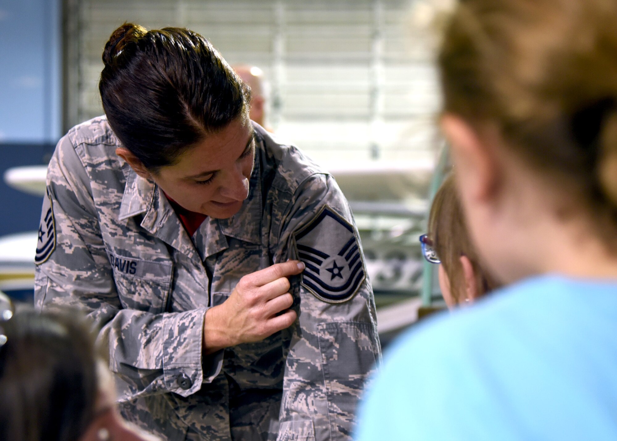 Master Sgt. Wilma Davis from the 117th Maintenance Squadron explains rank during the Women in Aviation event at the Southern Museum of Flight