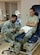 From left, U.S. Air Force Staff Sgt. Richard Johns, 633rd Medical Operations Squadron physical therapy technician, applies a therapeutic ultrasound treatment to Senior Airman Conner Ornelas’, 633rd MDOS physical therapy technician, knee at Joint Base Langley-Eustis, Va., Sept. 25, 2017.