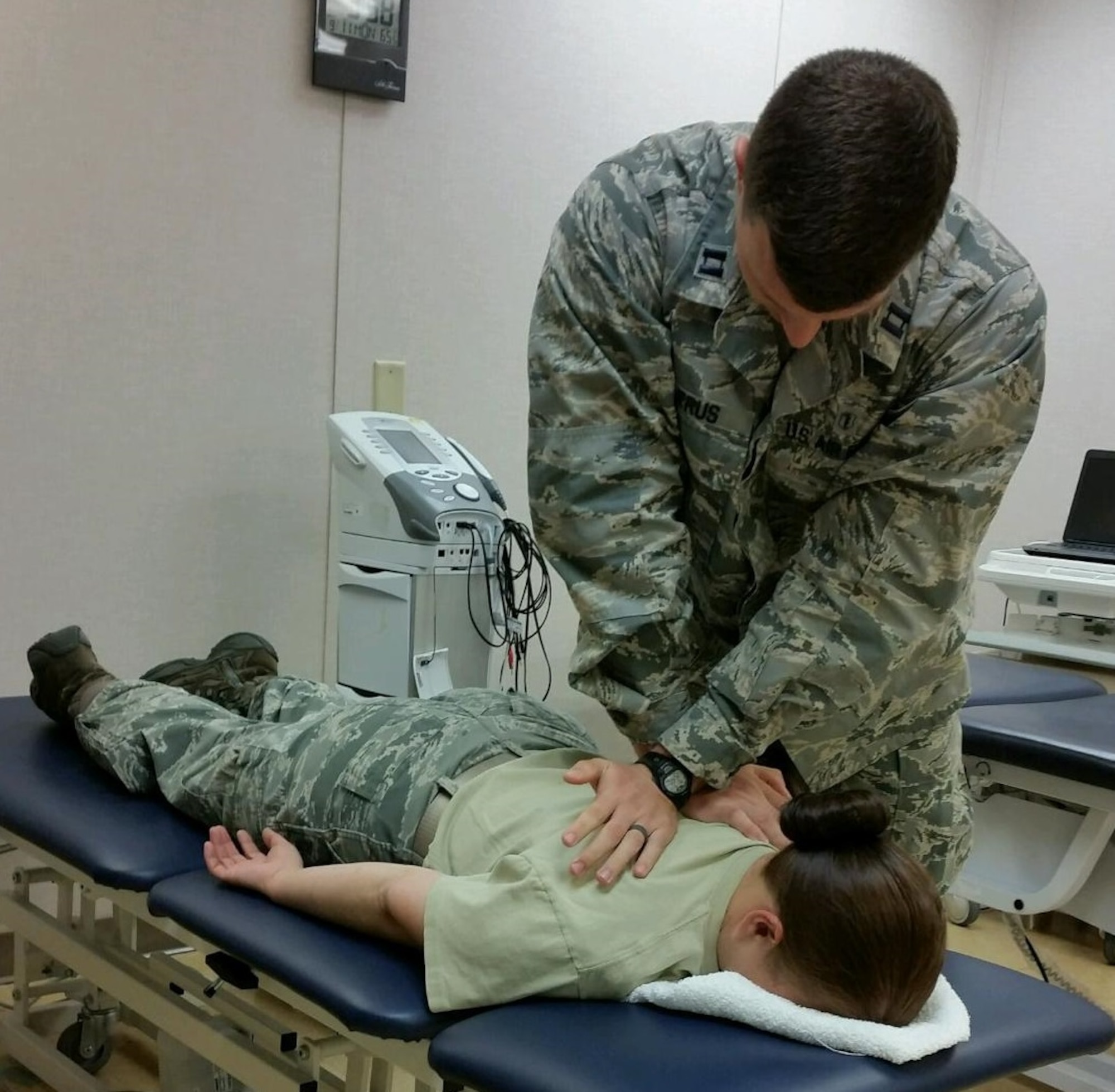 Right, U.S. Air Force Capt. Taylor Majerus, 633rd Medical Operations Squadron physical therapy element chief, uses a manual therapy technique to improve motion and decrease back pain at Joint Base Langley-Eustis, Va., Sept. 25, 2017.