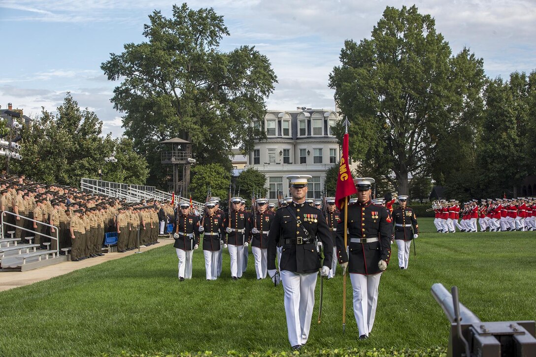 Marines with Bravo Company, Marine Barracks Washington D.C., march across the parade deck during a Troop Review Ceremony for Commandant General of the British Royal Marines, Maj. Gen. Robert A. Magowan, at the Barracks, October 10, 2017. General Magowan is the Commandant of General Royal Marines and the Commander of the United Kingdom Amphibious Forces. The hosting official for the ceremony was the Commandant of the Marine Corps, Gen. Robert B. Neller. (Official Marine Corps photo by Cpl. Robert Knapp/Released)