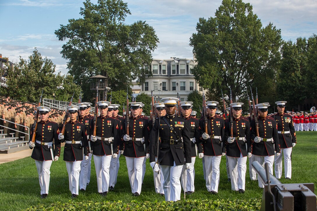 Captain Maxwell Romain, platoon commander, 1st platoon, Bravo Company, Marine Barracks Washington D.C., marches his platoon across the parade deck during a Troop Review Ceremony for Commandant General of the British Royal Marines, Maj. Gen. Robert A. Magowan, at the Barracks, October 10, 2017. General Magowan is the Commandant of General Royal Marines and the Commander of the United Kingdom Amphibious Forces. The hosting official for the ceremony was the Commandant of the Marine Corps, Gen. Robert B. Neller. (Official Marine Corps photo by Cpl. Robert Knapp/Released)