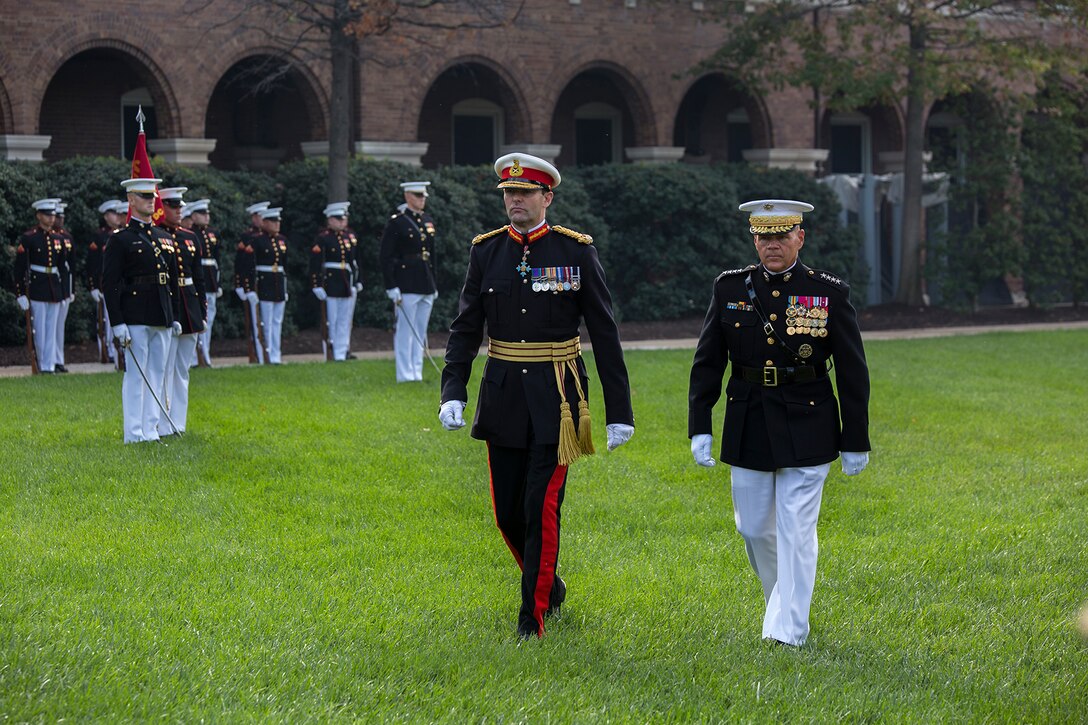 The Commandant of the Marine Corps, Gen. Robert B. Neller, and Commandant General of the British Royal Marines, Maj. Gen. Robert A. Magowan, march across the parade deck during a Troop Review Ceremony for General Magowan at Marine Barracks Washington D.C., October 10, 2017. Magowan is the Commandant of General Royal Marines and the Commander of the United Kingdom Amphibious Forces. The hosting official for the ceremony was General Neller. (Official Marine Corps photo by Cpl. Robert Knapp/Released)