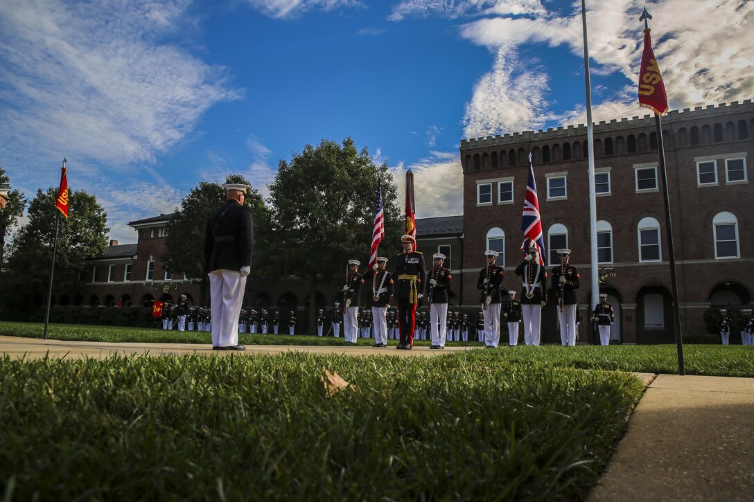 The Commandant of the Marine Corps, Gen. Robert B. Neller, and Commandant General of the British Royal Marines, Maj. Gen. Robert A. Magowan, stand at attention during a Troop Review Ceremony at Marine Barracks Washington D.C., October 10, 2017. General Magowan is the Commandant of General Royal Marines and the Commander of the United Kingdom Amphibious Forces. (Official Marine Corps photo by Lance Cpl. Damon McLean/Released)