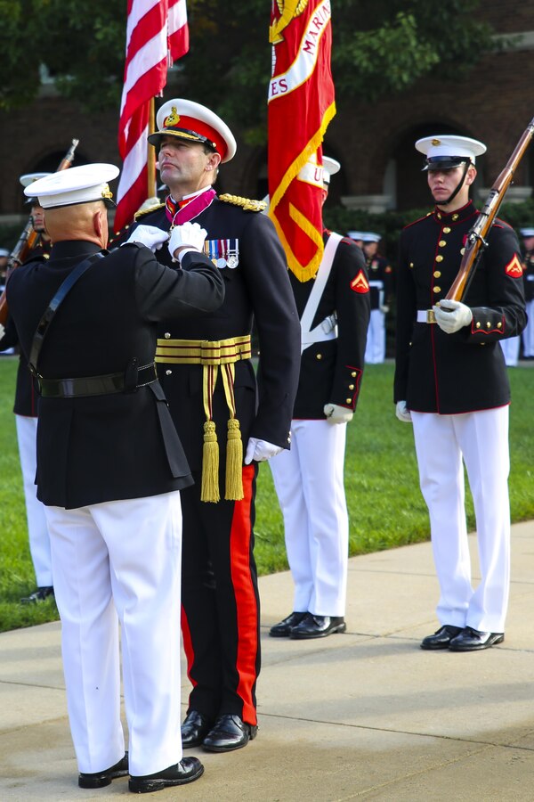 The Commandant of the Marine Corps, Gen. Robert B. Neller, awards the Legion of Merit to Commandant General of the British Royal Marines, Maj. Gen. Robert A. Magowan, during a Troop Review Ceremony at Marine Barracks Washington D.C., October 10, 2017. The Legion of Merit is a military award given for exceptionally meritorious conduct in the performance of outstanding services and achievement. (Official Marine Corps photo by Lance Cpl. Damon McLean/Released)