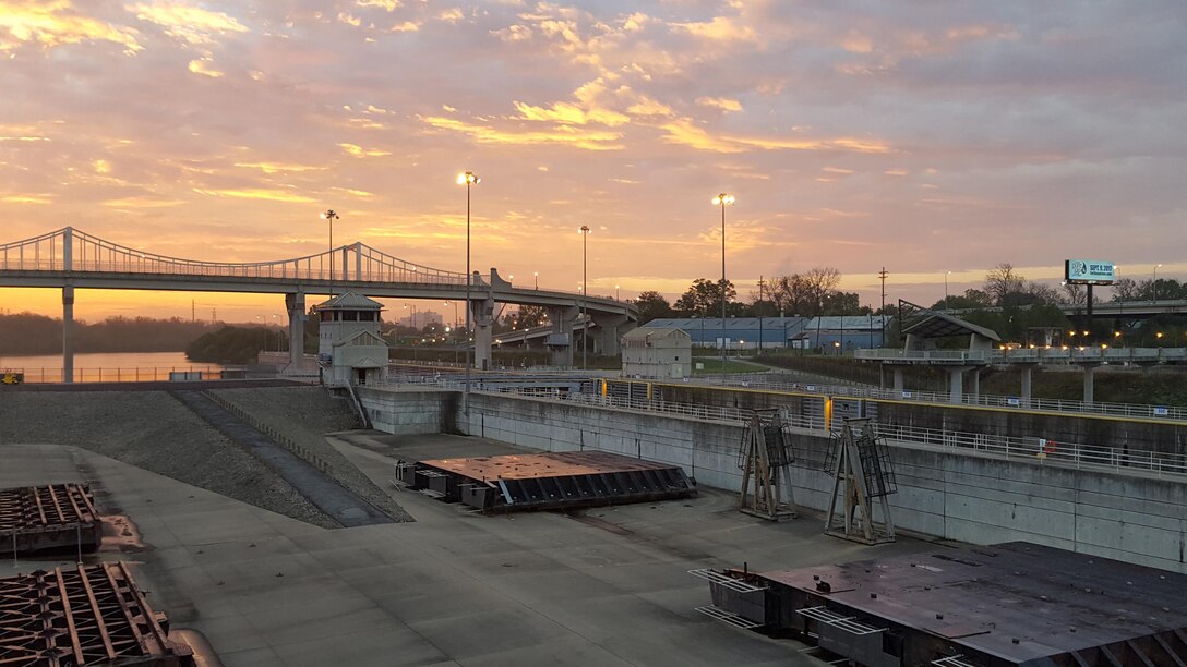 The sun rises over McAlpine Locks and Dam on the Ohio River at Louisville, Kentucky.